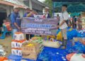 Komunitas MMF menyalurkan bantuan kemanusiaan kepada korban bencana banjir dan longsor di Gampong Meunasah Mancang, Kecamatan Meurah Dua, Kabupaten Pidie Jaya, Minggu (14/12/2025). (Dok. Ho Tubinnews).