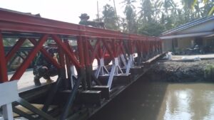 IMG-20260331-WA0001-300x169 Kodim 0208/AS Rampungkan Pembangunan Jembatan Modular di Desa Lubuk Palas